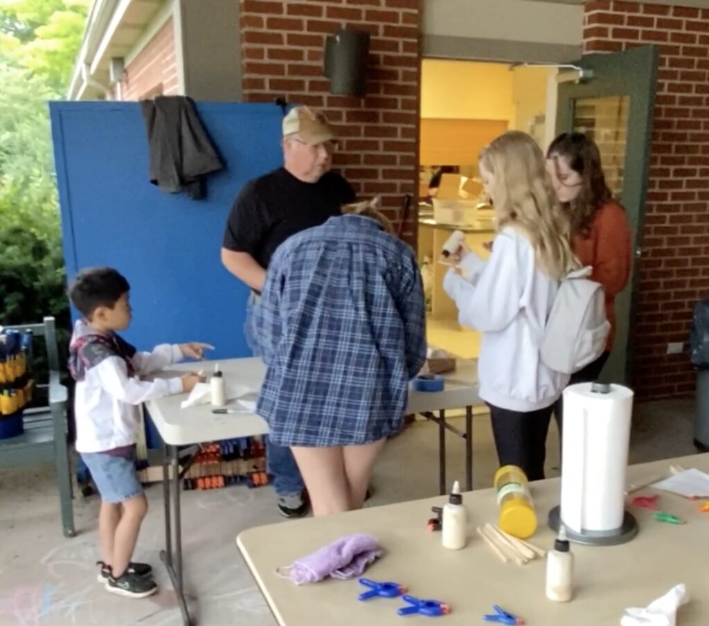 Kids making kazoos
